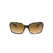 Elegante solbriller med lys Havana-ramme og brune gradientlinser