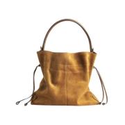 Mellemstor brun ruskindstaske med læderhåndtag