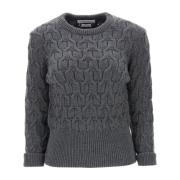 Sweater i uld med kabelstrik og trefarvet detalje
