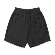 Sorte elastiske talje shorts med broderede kanter