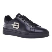 Trainers in black laminated leather and leather