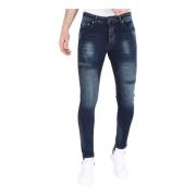 Mørkeblå Stonewash Jeans med huller og striber