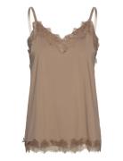 Top From Freequent In A Light Material. The Top Has A Simple Silhouett...