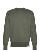 Woven Tab Crew Neck Tops Sweatshirts & Hoodies Sweatshirts Green Calvi...